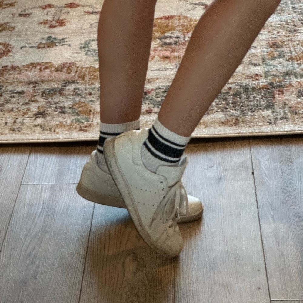 Worn white adidas Stan smith sneakers